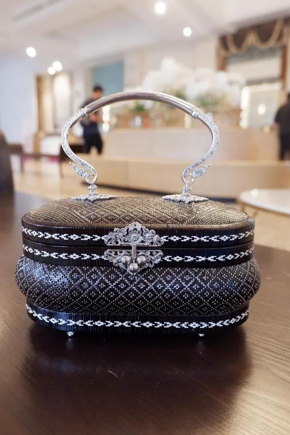 Yan Lipao Woven Handbag